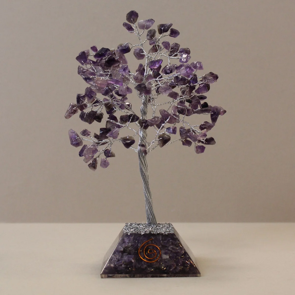 Gemstone tree ornament with 160 amethyst stones on an organite base, decorative and colorful display piece