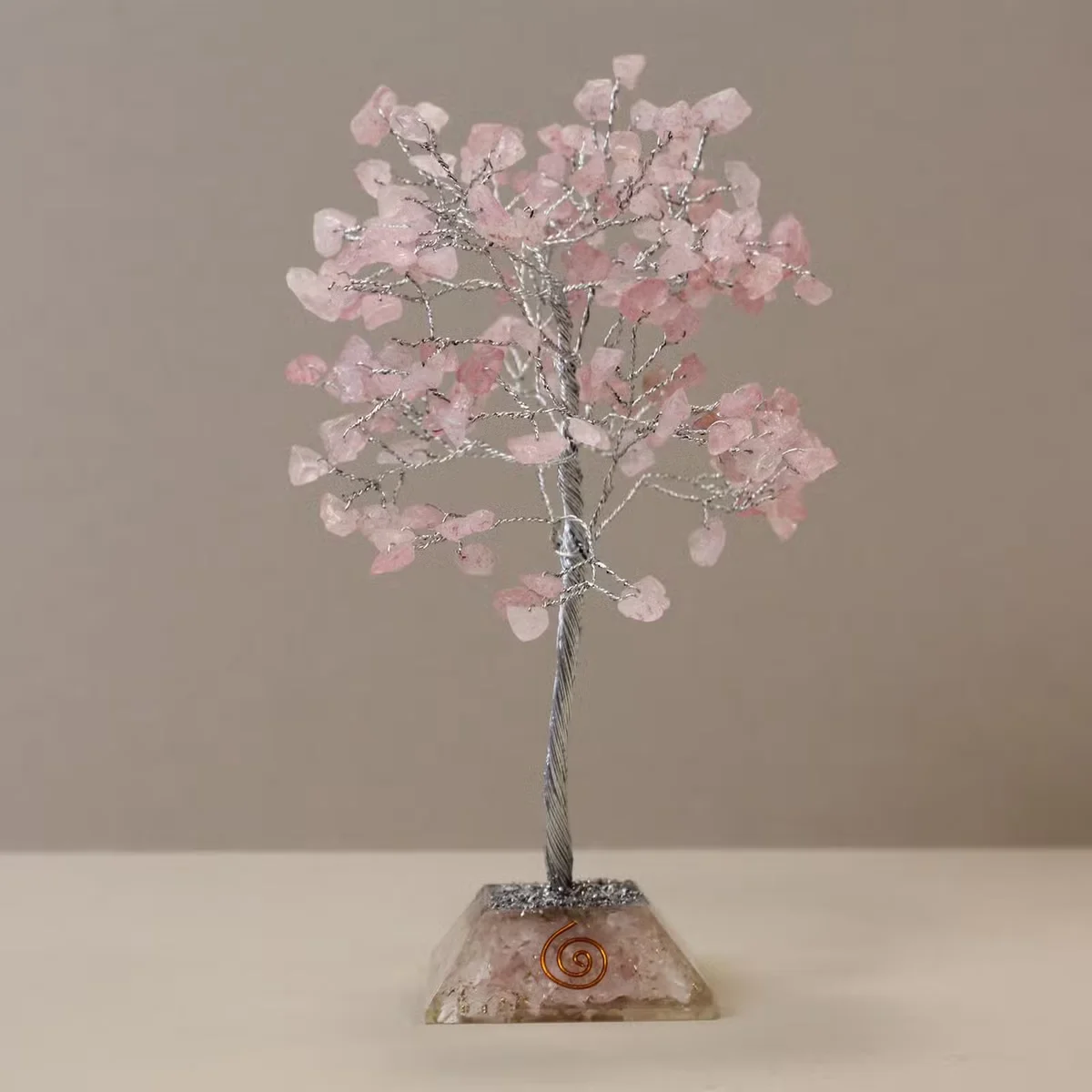 Gemstone tree with 160 rose quartz stones on an organite base, ideal rose quartz decor for home or office