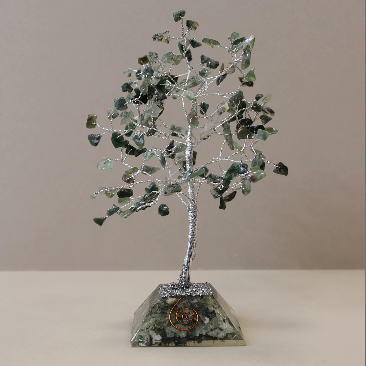 Gemstone tree featuring 160 moss agate stones on a decorative organite base decoration with natural colors