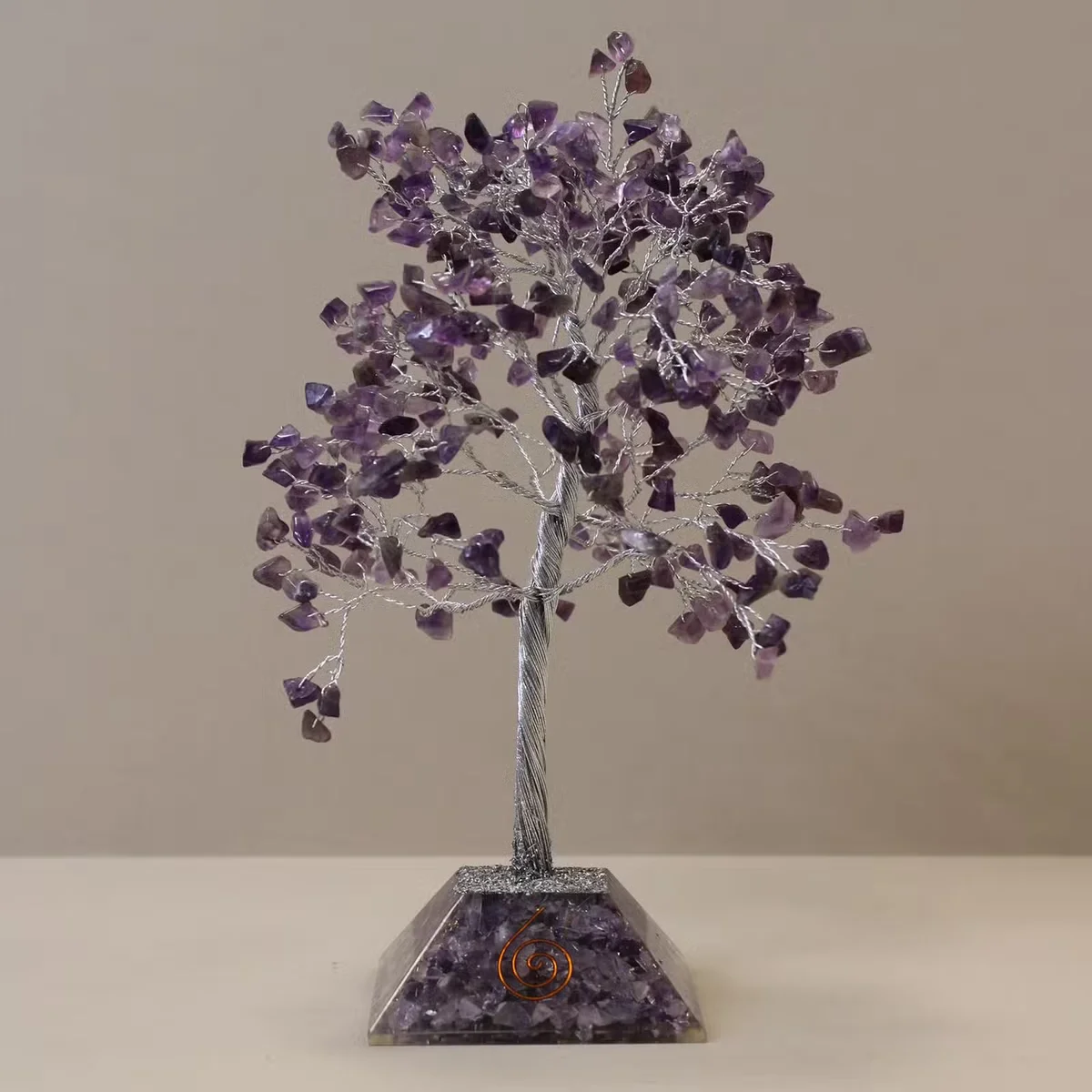Gemstone tree with amethyst 320 stone tree and organite base on white background