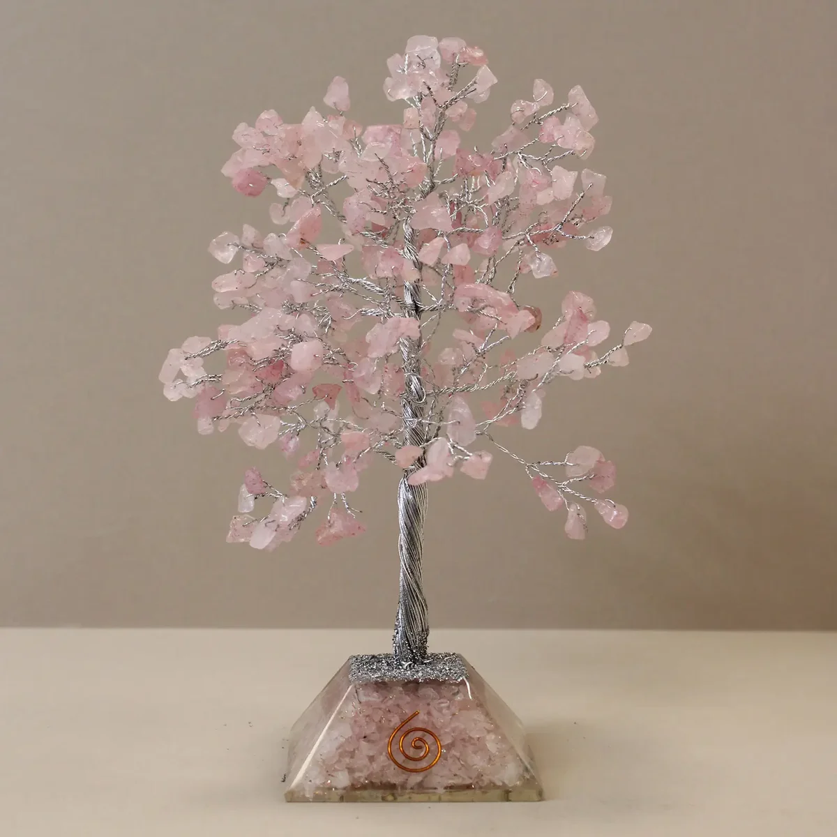 Gemstone tree ornament with rose quartz stones on an organite base, featuring 320 small polished stones
