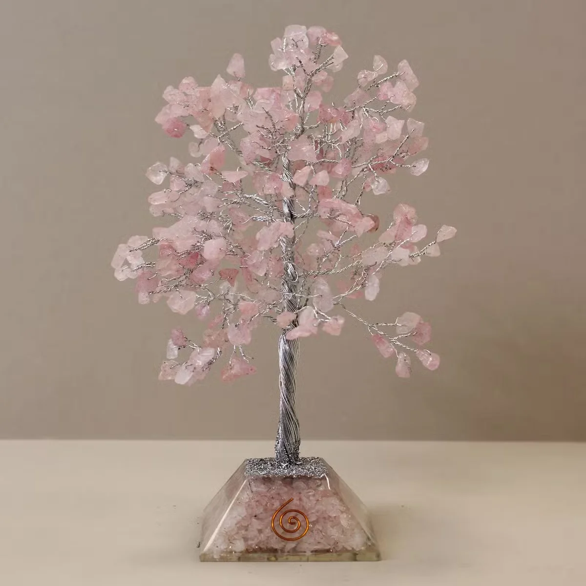 Gemstone tree with pink rose quartz stones on an organite base, decorative rose quartz decor item