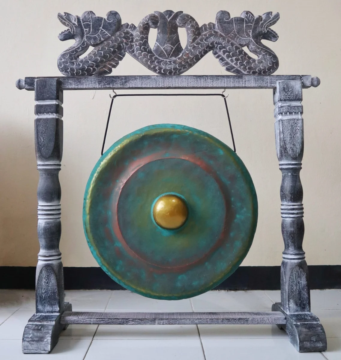 Small 25cm gong with stand in greenwash finish on a plain background, showing the full instrument and stand design