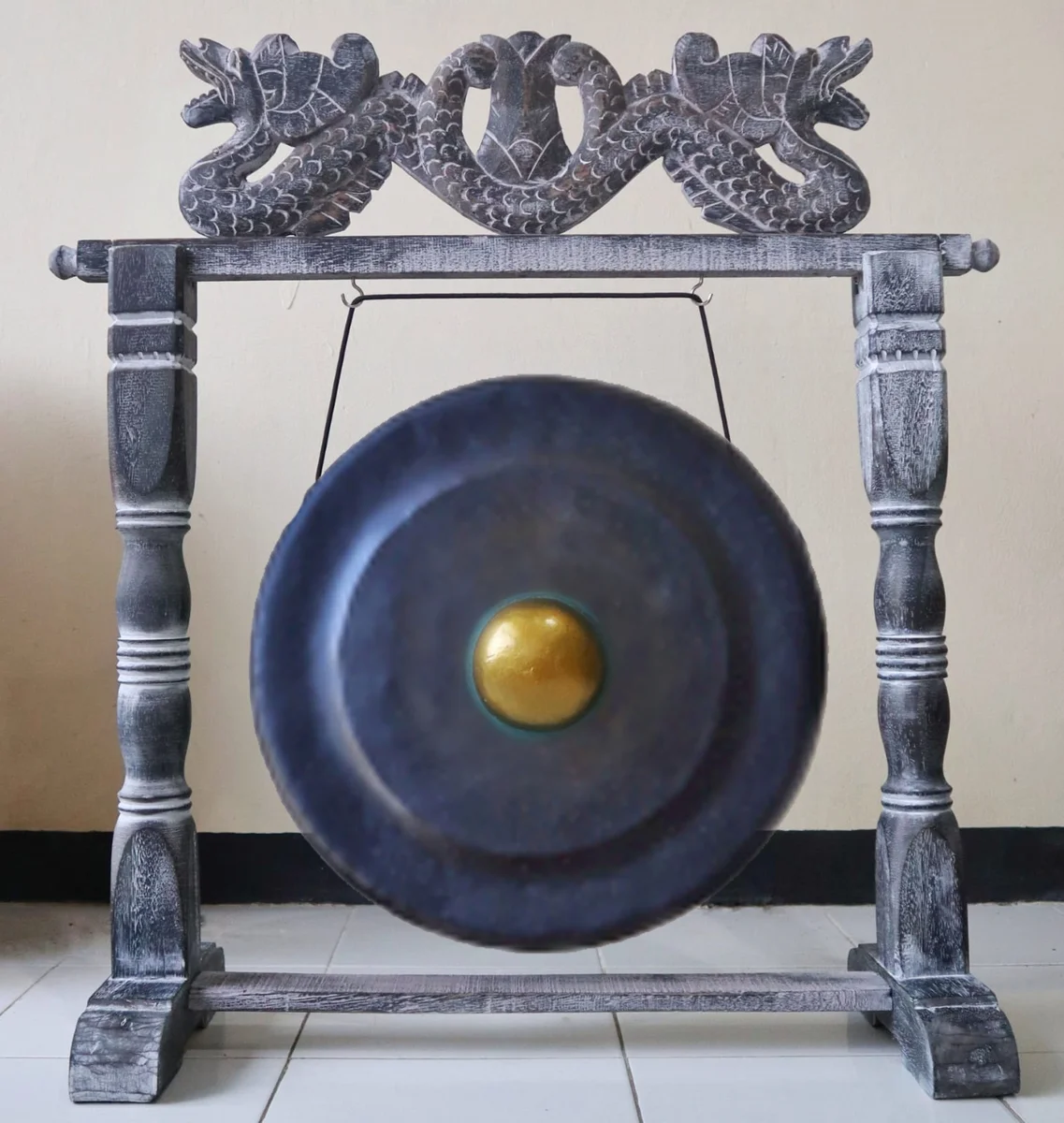 Medium gong in stand with 50cm diameter, black finish, displayed on a black metal frame stand