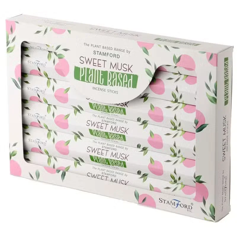 Bundle of plant based aromatic incense sticks labeled Sweet Musk on a plain background