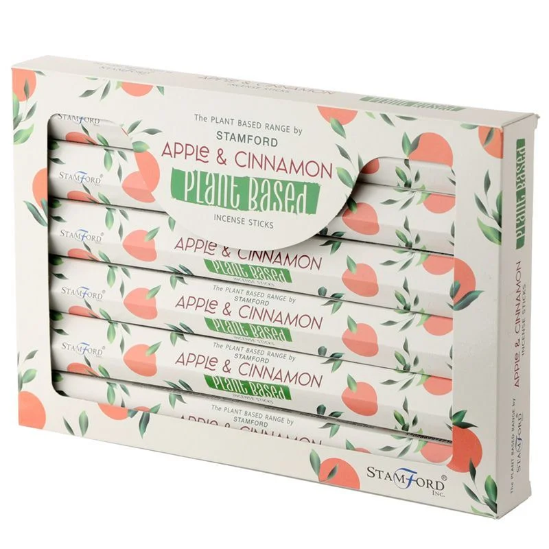 Box of plant based incense sticks with apple and cinnamon scent on a white background