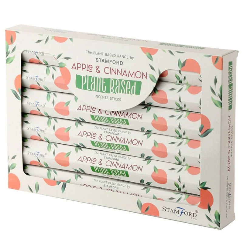 Bundle of plant based natural incense sticks with apple and cinnamon scent on a white background