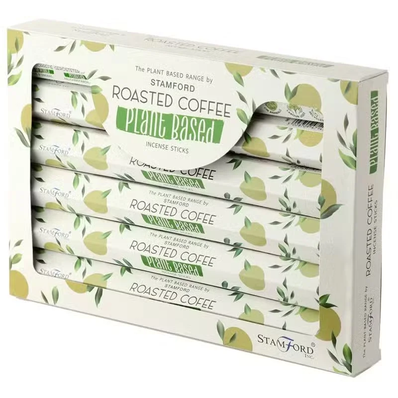 Bundle of plant based incense sticks with roasted coffee scent against a plain background, coffee scented incense