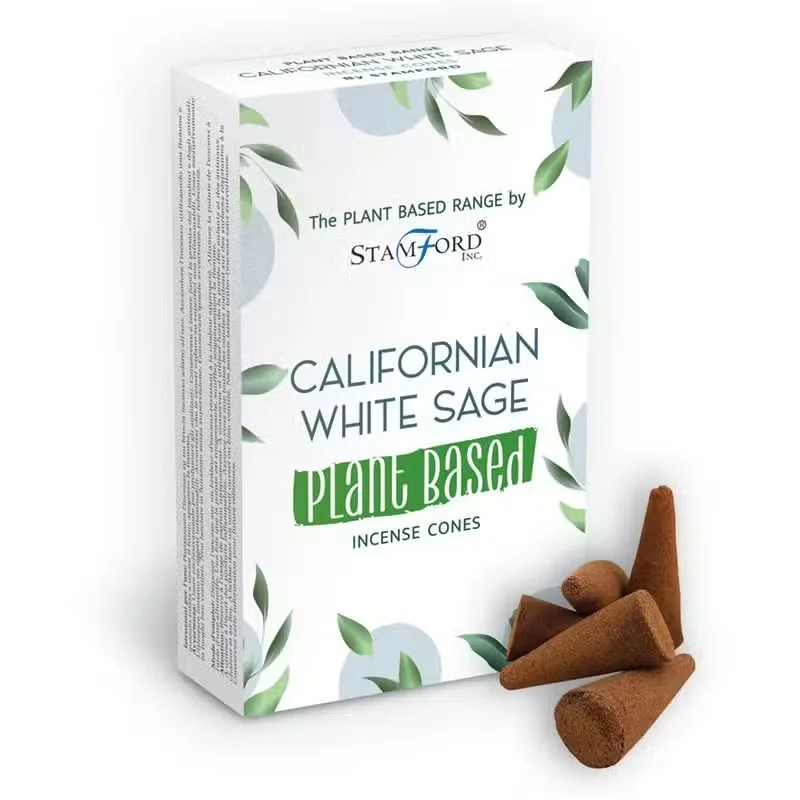 Herbal incense cones made from Californian white sage arranged on a wooden surface with smoke rising gently