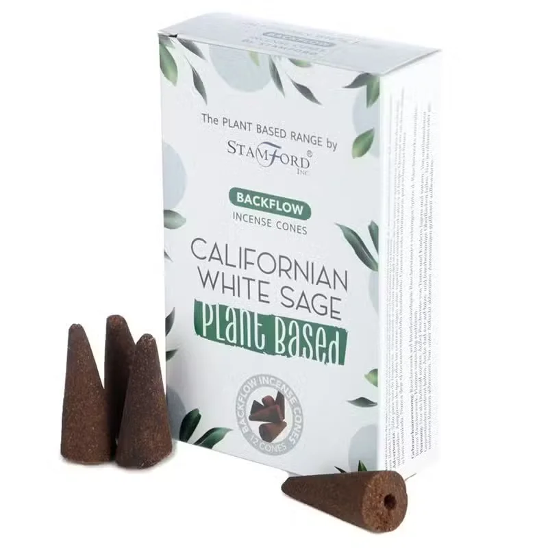 Stack of plant based Californian white sage aromatherapy incense cones arranged on a wooden surface