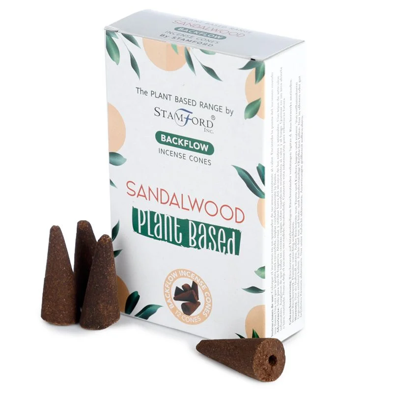 Stack of brown sandalwood incense cones arranged on a wooden surface for backflow use
