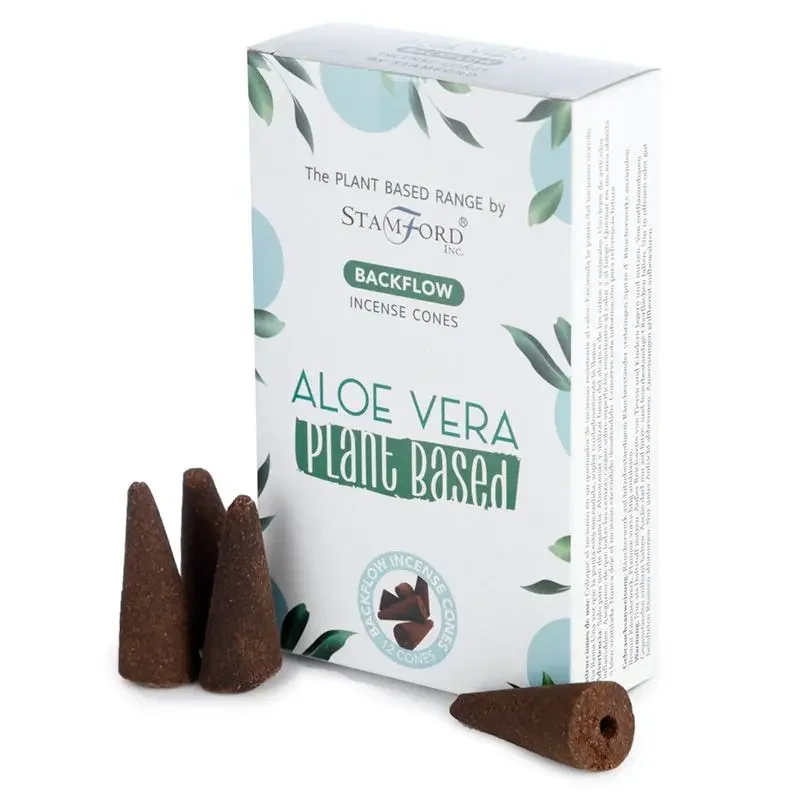 Plant based incense cones in aloe vera scent arranged on a wooden surface with smoke gently flowing downwards