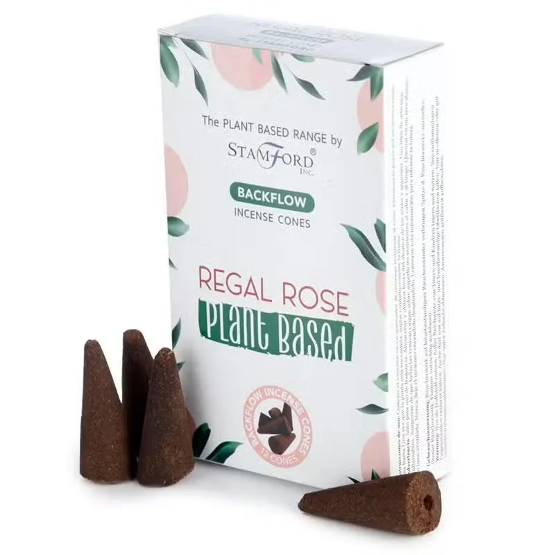 Regal Rose plant based backflow aromatherapy cones arranged on a decorative holder with smoke flowing downwards