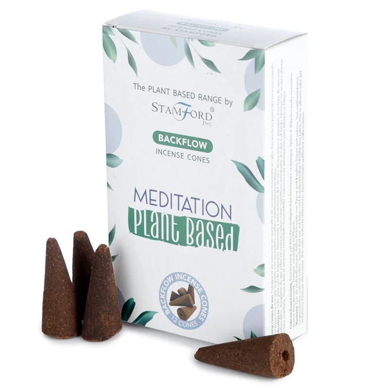Plant based backflow incense cones arranged for meditation with smoke flowing downwards in a calm setting