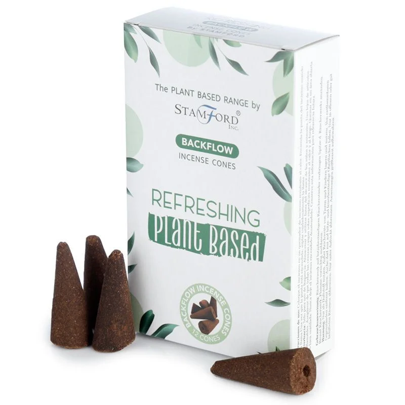 Plant based backflow incense cones arranged on a holder with smoke gently flowing downwards, refreshing scent theme.