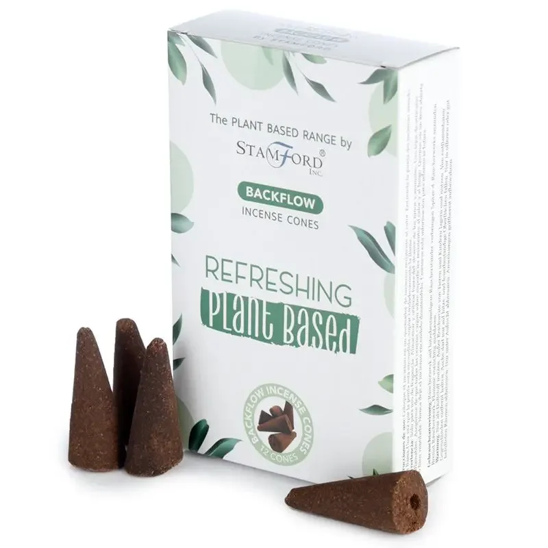 Plant based backflow incense cones arranged on a holder, emitting fragrant smoke for a refreshing atmosphere