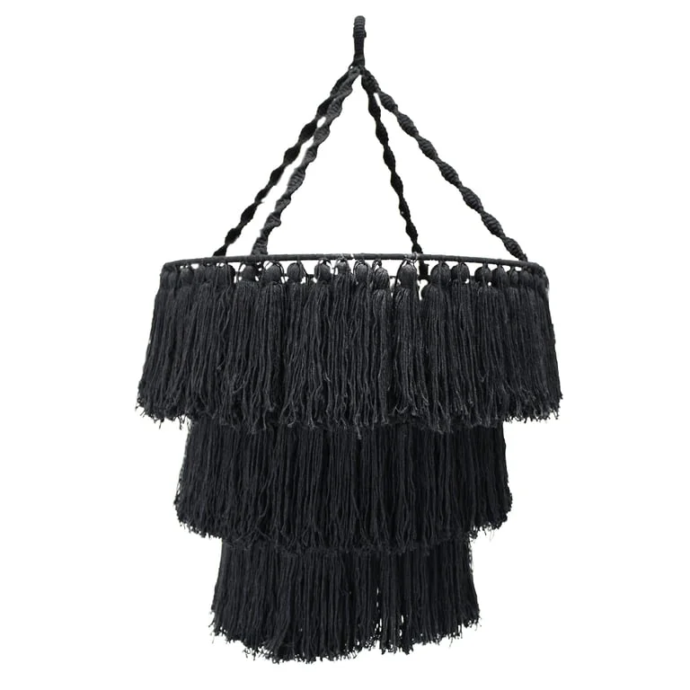 Black soft macrame chandelier, delicately woven ropes hangs from ceiling, minimalist elegant lighting fixture.
