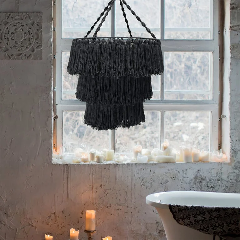 Black macrame chandelier hanging as a black ceiling light, soft ambient fixture.
