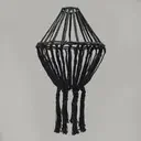 Large black chandelier with macramé hanging design.