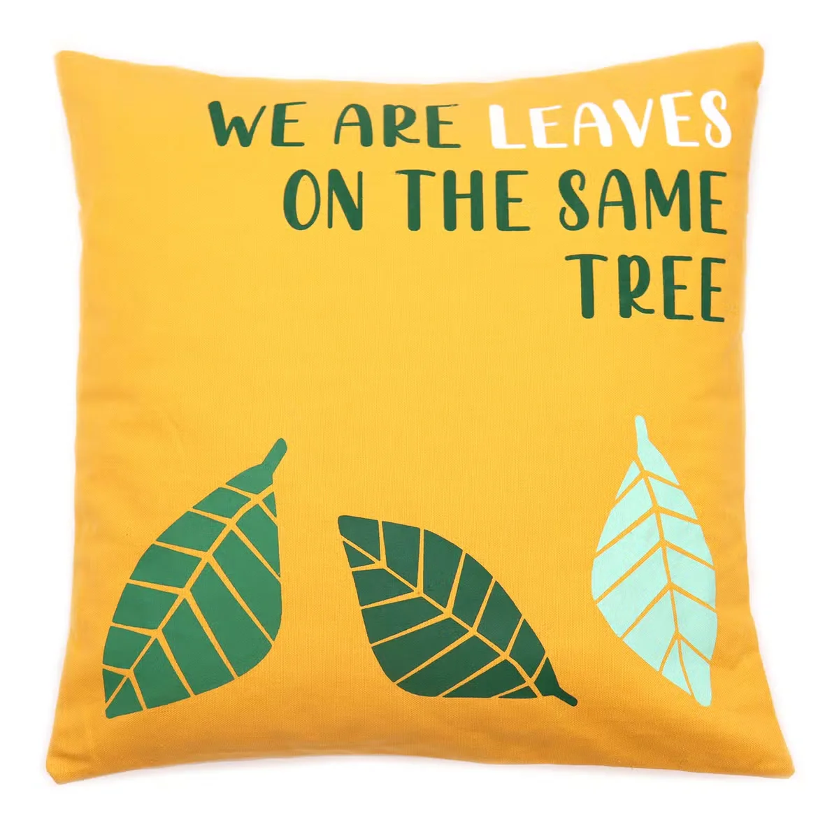 Yellow blue cushion cover with natural background featuring printed leaf design on cotton fabric