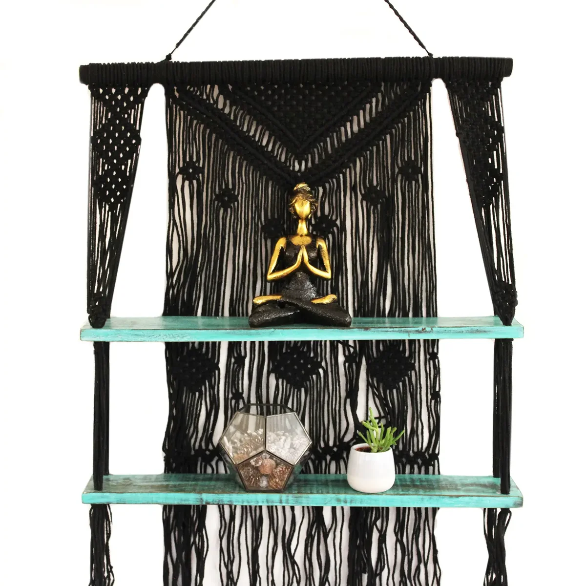 Black macrame shelves in black with turquoise accents hanging against a plain background