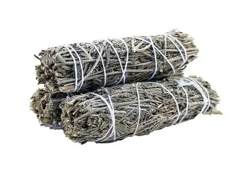 Smudge stick 10cm made of lavender and sage wrapped tightly with natural twine against a white background