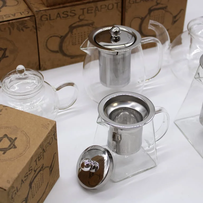 Clear glass tea pot with round pearl shape, 800ml capacity, includes an infuser.