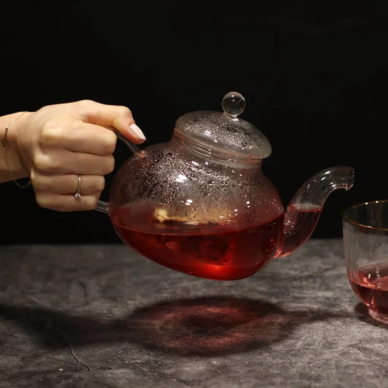Clear glass teapot with round pearl design and built‑in infuser, 800ml capacity.
