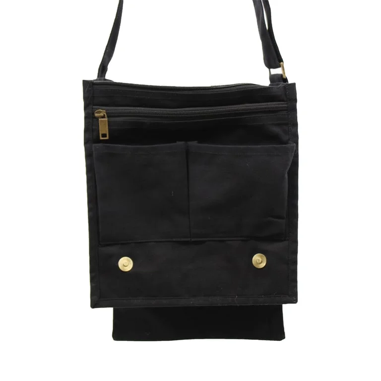 Black cotton canvas messenger bag on white background, showing duffel strap, zipper, tote handle and front flap.