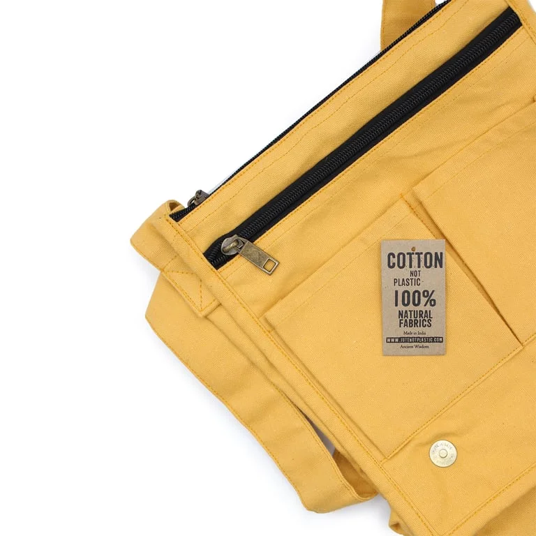 Yellow cotton canvas messenger bag, styled as a canvas shoulder bag, displayed on a light background.