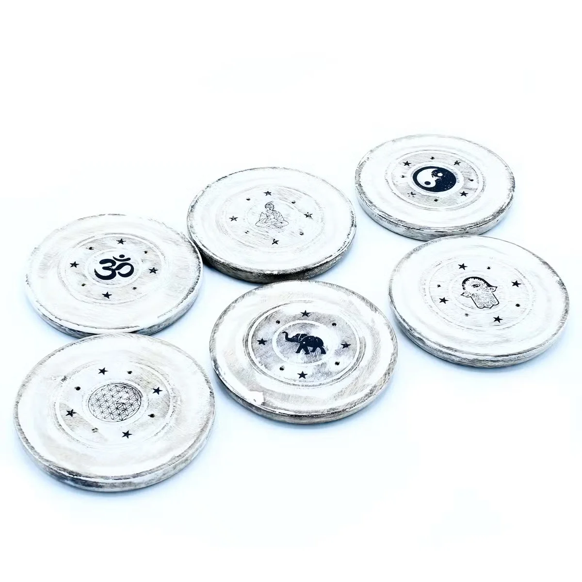 White washed decorative incense holder with cone and incense disc displayed on a plain background