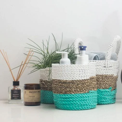 Set of natural white seagrass baskets arranged together, natural storage baskets