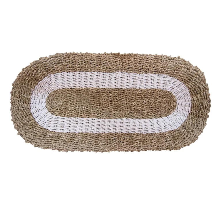 Oval seagrass basket in white and tan, elongated shape, textured weave, 60x120cm, displayed against neutral background.