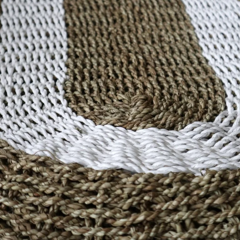 Classic oval seagrass basket in white and tan, measuring 60x120cm