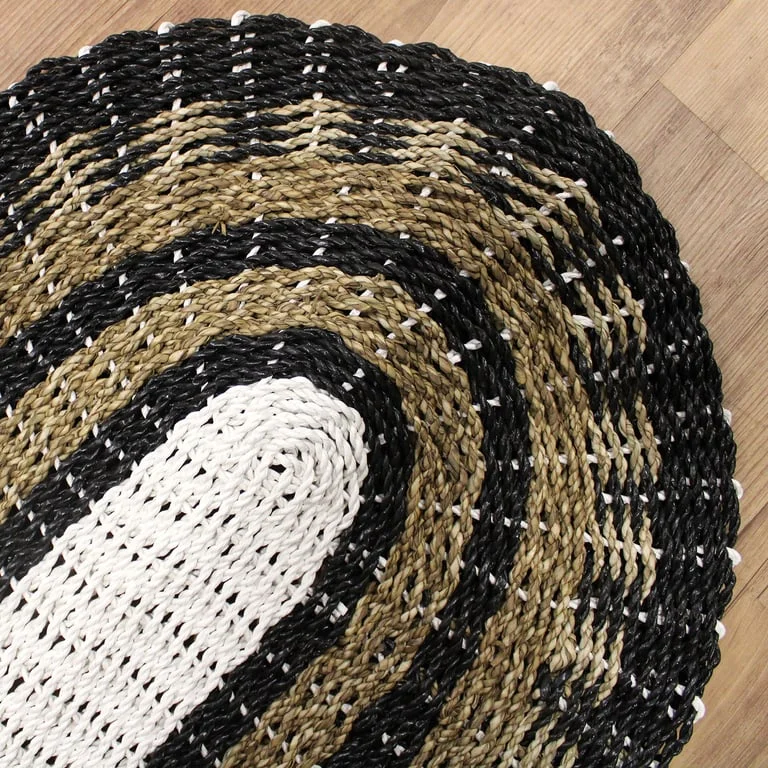 Oval seagrass storage basket in black, white and tan, 60x120cm size.