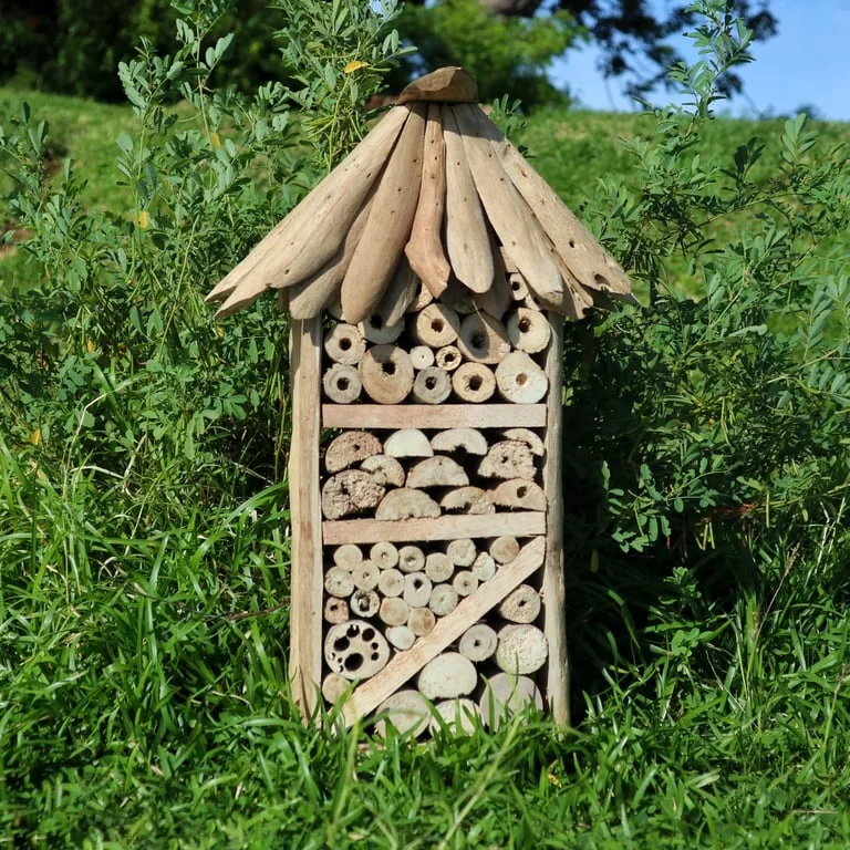 Driftwood bee insect box, wooden highrise design with stacked panels and bee & insect decorative motifs.