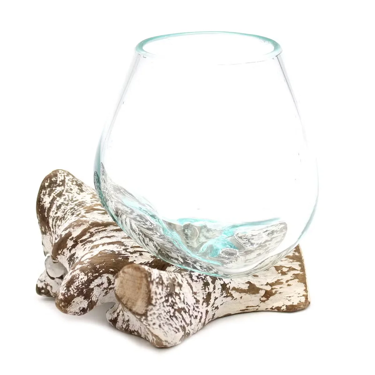 Decorative small bowl with molten glass design on whitewash wood surface, showcasing artistic craftsmanship