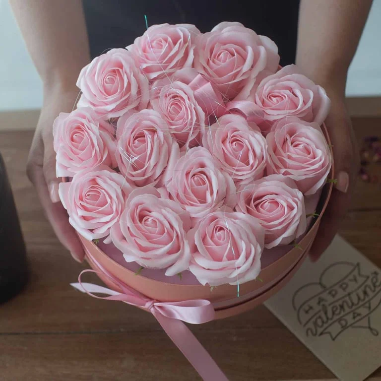 Soap flower bouquet of 13 pink roses arranged in a heart shape