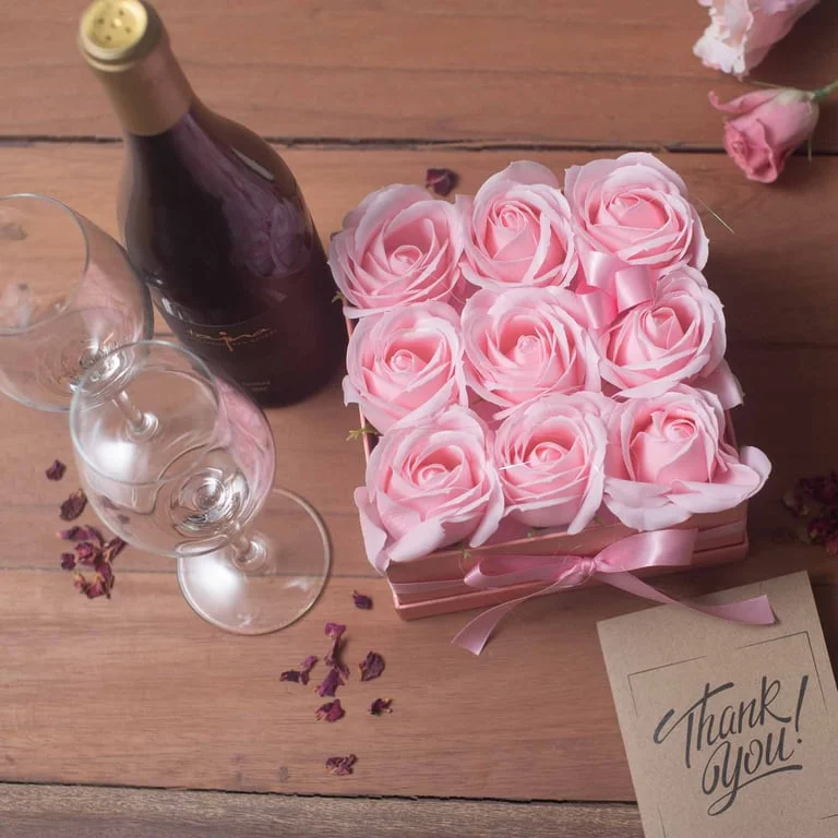soap flower bouquet of 13 pink roses arranged in a heart shape