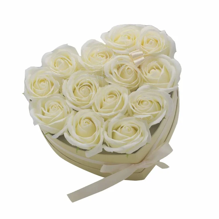 Soap flower bouquet of 13 cream roses arranged in a heart shape.
