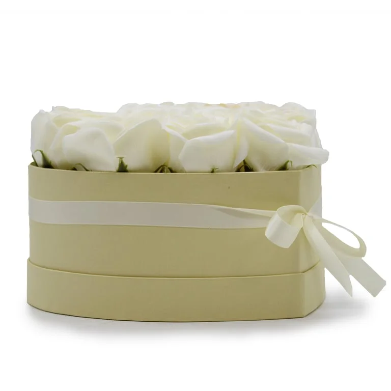 Soap flower bouquet of 13 cream roses arranged to form a heart shape