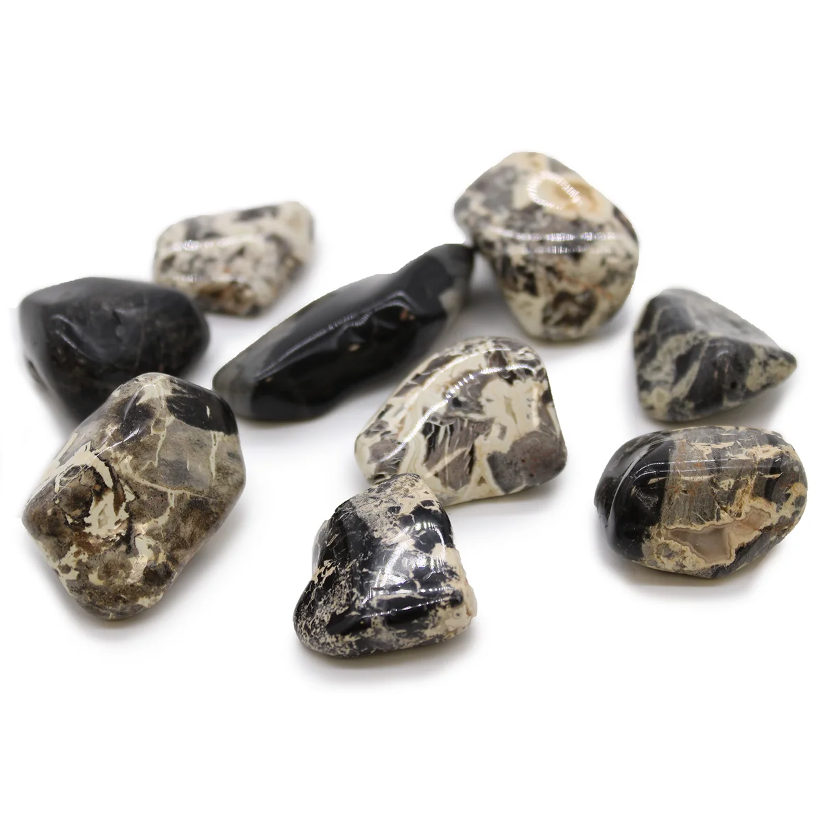 Jasper decorative tumble stones in silver leaf, displayed on a light background.