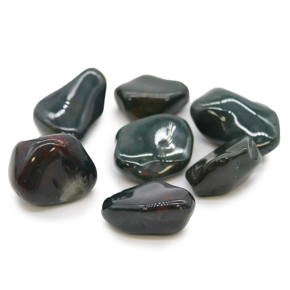 Large bloodstone stones arranged on a neutral background.