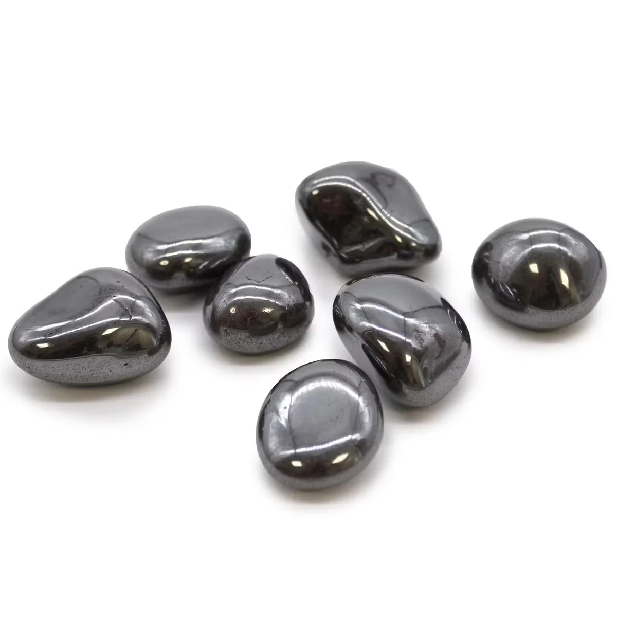 Large tumble stone in hematite, glossy surface showing polished edges, showcasing a sizeable black mineral.