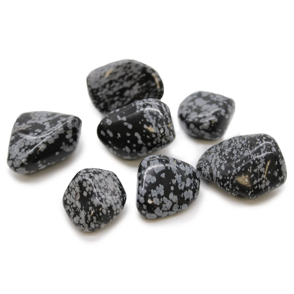Set of XL obsidian tumble stones in snowflake pattern, glossy dark surface.