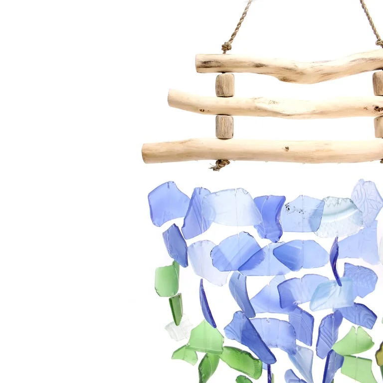 Colourful wall art featuring three sticks in blue and green hues.