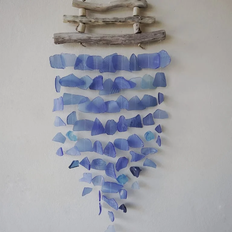 Three blue sticks arranged as modern wall décor.