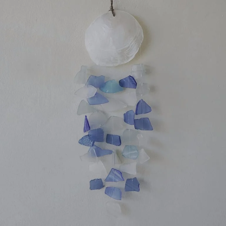 Blue and white glass drop decoration on a glass object