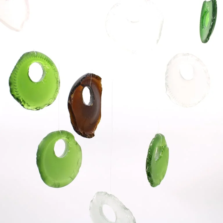 Assorted bottle bottom chimes forming a small wind chime set