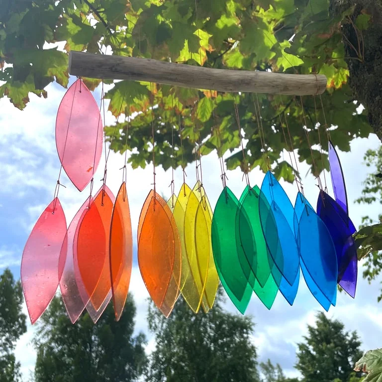 Assorted rainbow chimes displayed.